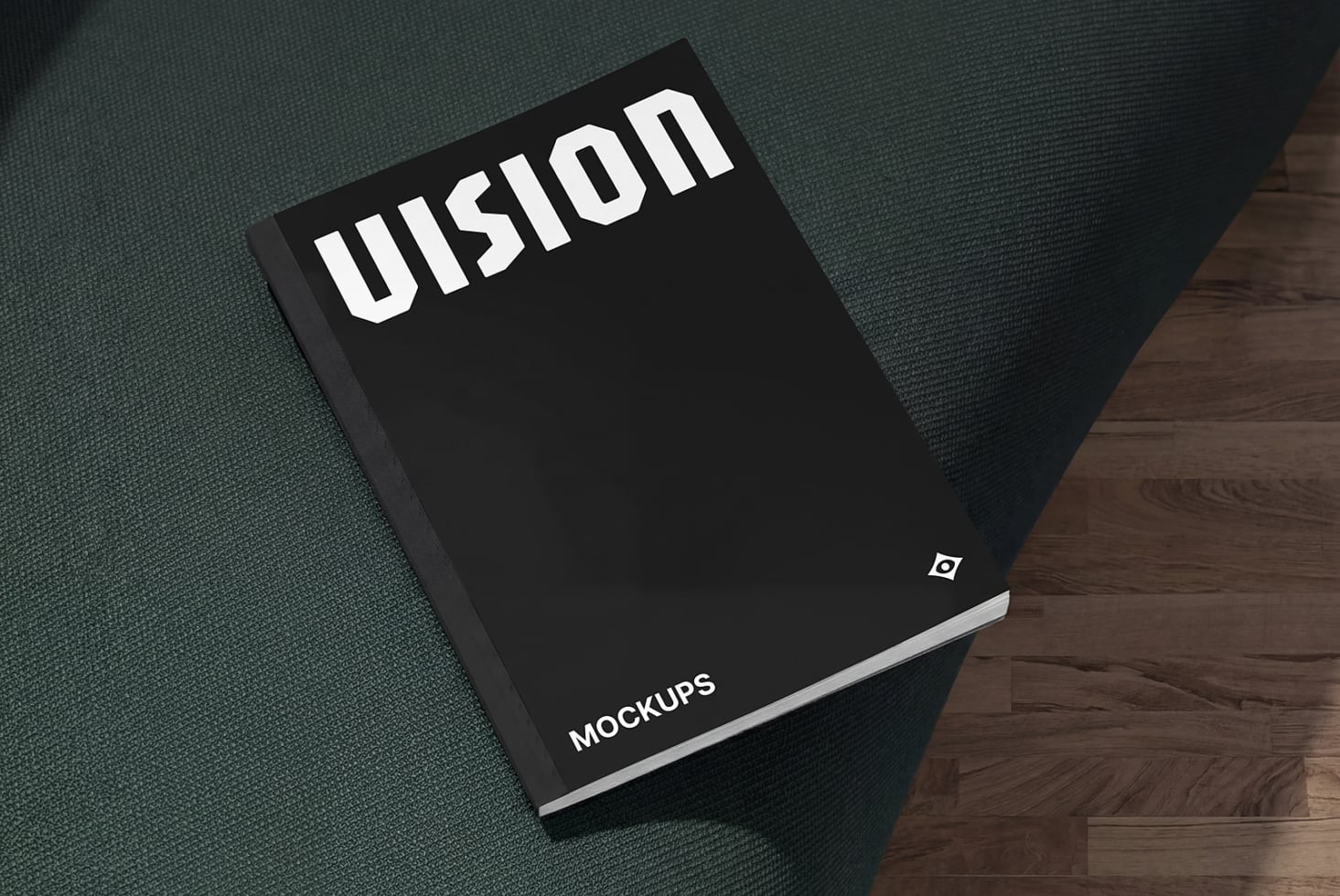 Black hardcover book with white Illusion text on top held against fabric texture