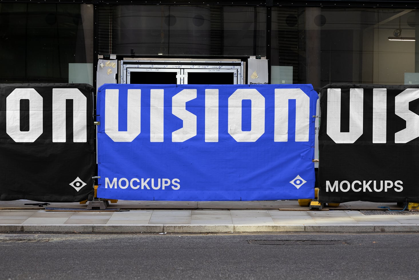 Blue hoarding billboard mockup with white sans-serif letters split between dark side panels