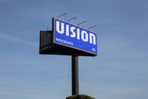 Tall billboard structure displaying VISION text in white on dark background