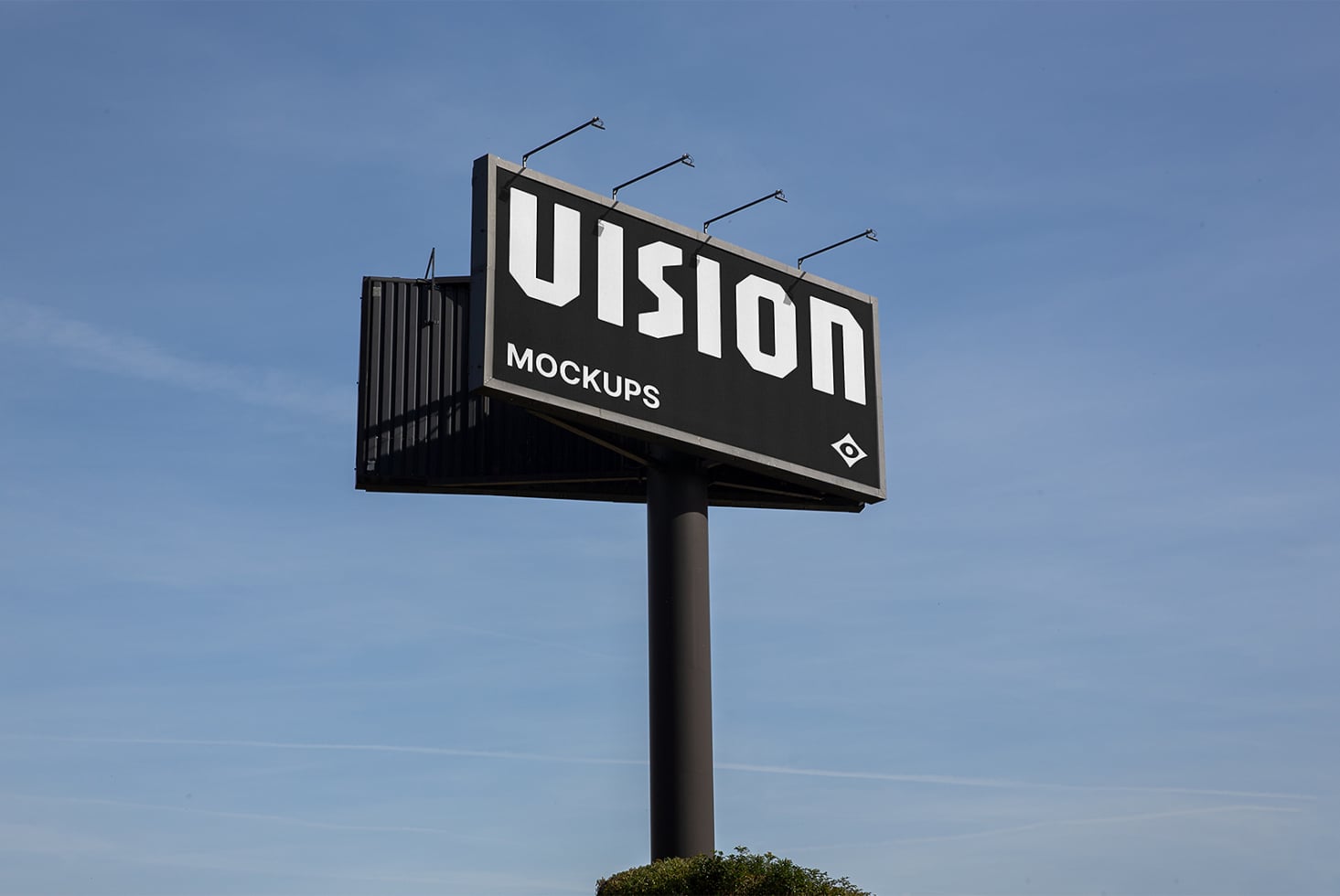 Large illuminated billboard featuring VISION text with lights on tall pole
