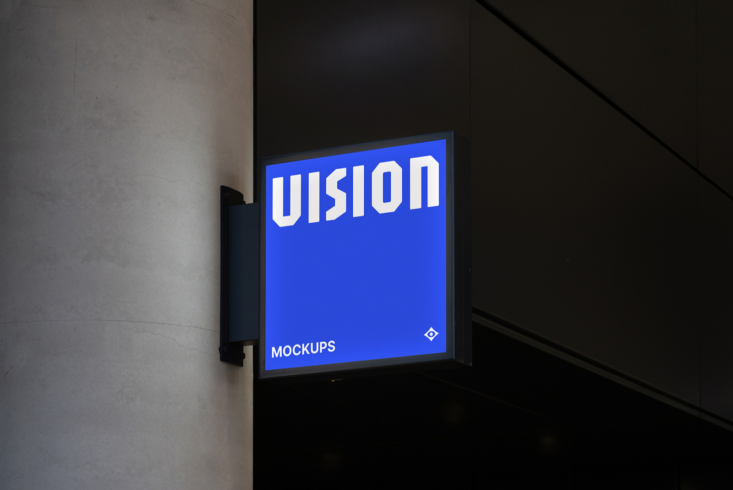 Bright blue illuminated storefront sign mounted on dark wall with white VISION text glowing