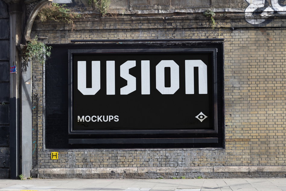 Black storefront display showing VISION text on brick building