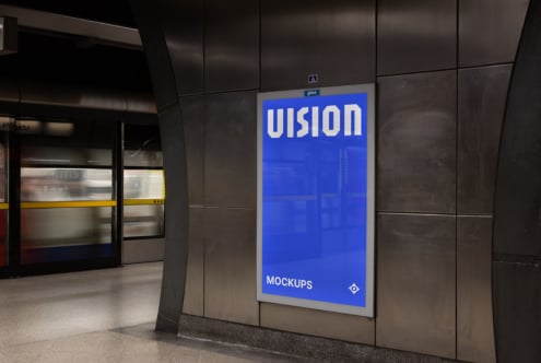 Bright blue subway station poster display with white VISION text glowing in station environment