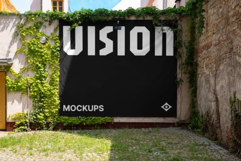 Outdoor black banner mockup with white UIsion text surrounded by climbing ivy