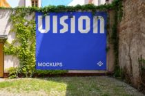 Vibrant blue outdoor banner mockup displaying large white UIsion typography with vines