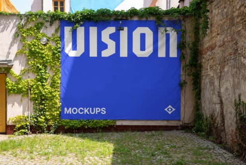 Vibrant blue outdoor banner mockup displaying large white UIsion typography with vines