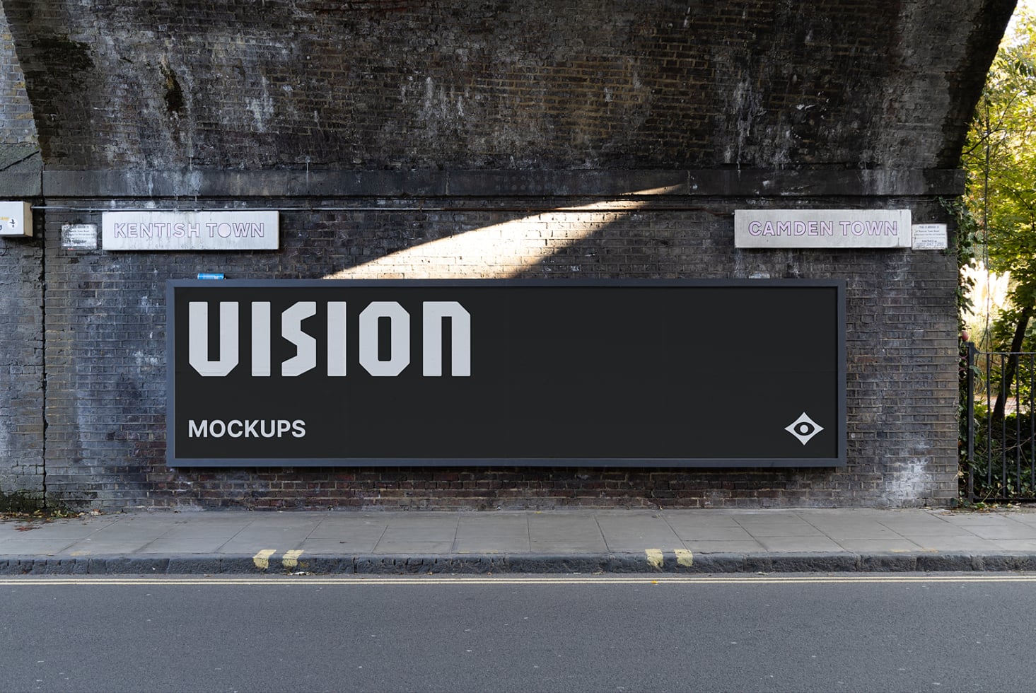 Large black billboard with VISION text on weathered brick wall