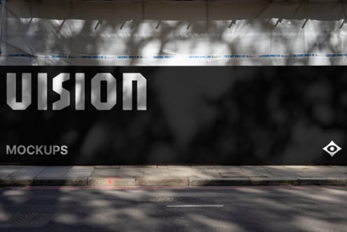 Dark storefront window showcasing UISION in metallic letters on black banner
