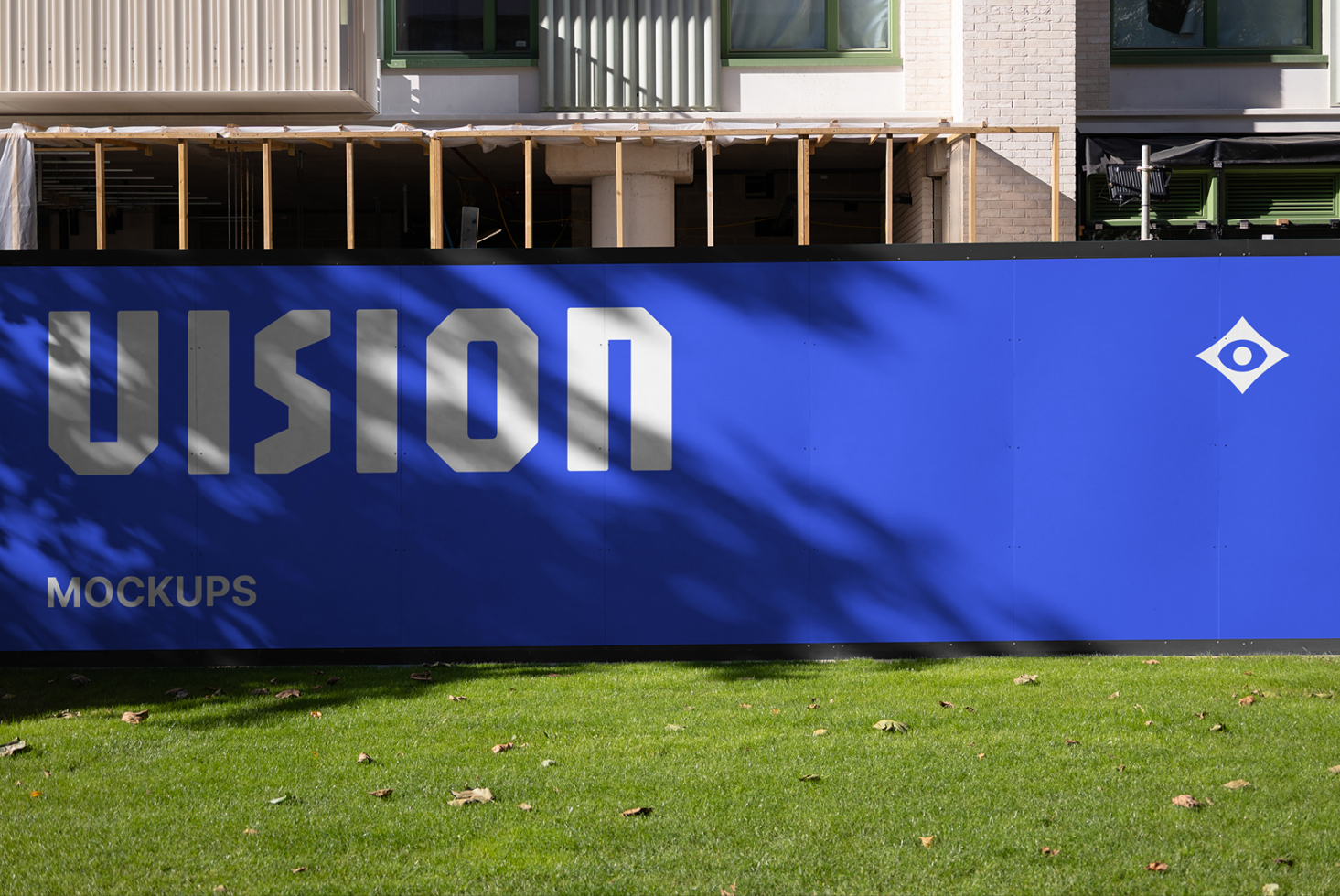 Blue storefront sign with VISION lettering, metal frame on lawn