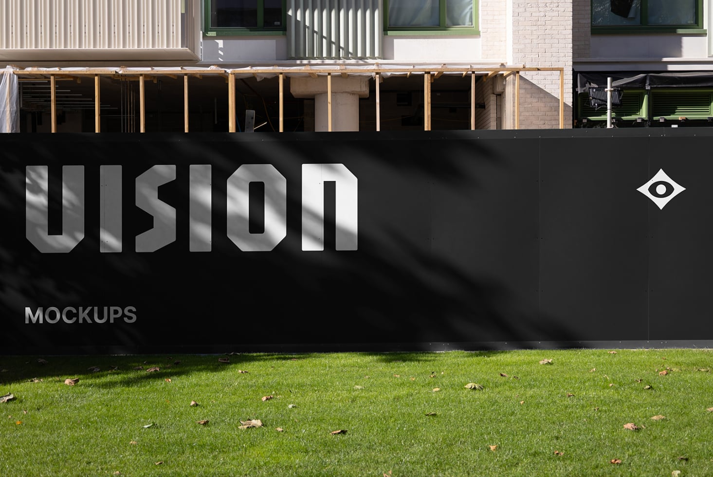 Black storefront sign with VISION lettering, metal frame on lawn