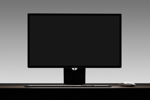 Minimalist computer desk setup with blank monitor mockup, keyboard, and mouse on dark surface. Perfect for design presentations and workspace graphics.