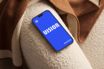 Phone mockup with blue screen on cream texture with brown fabrics
