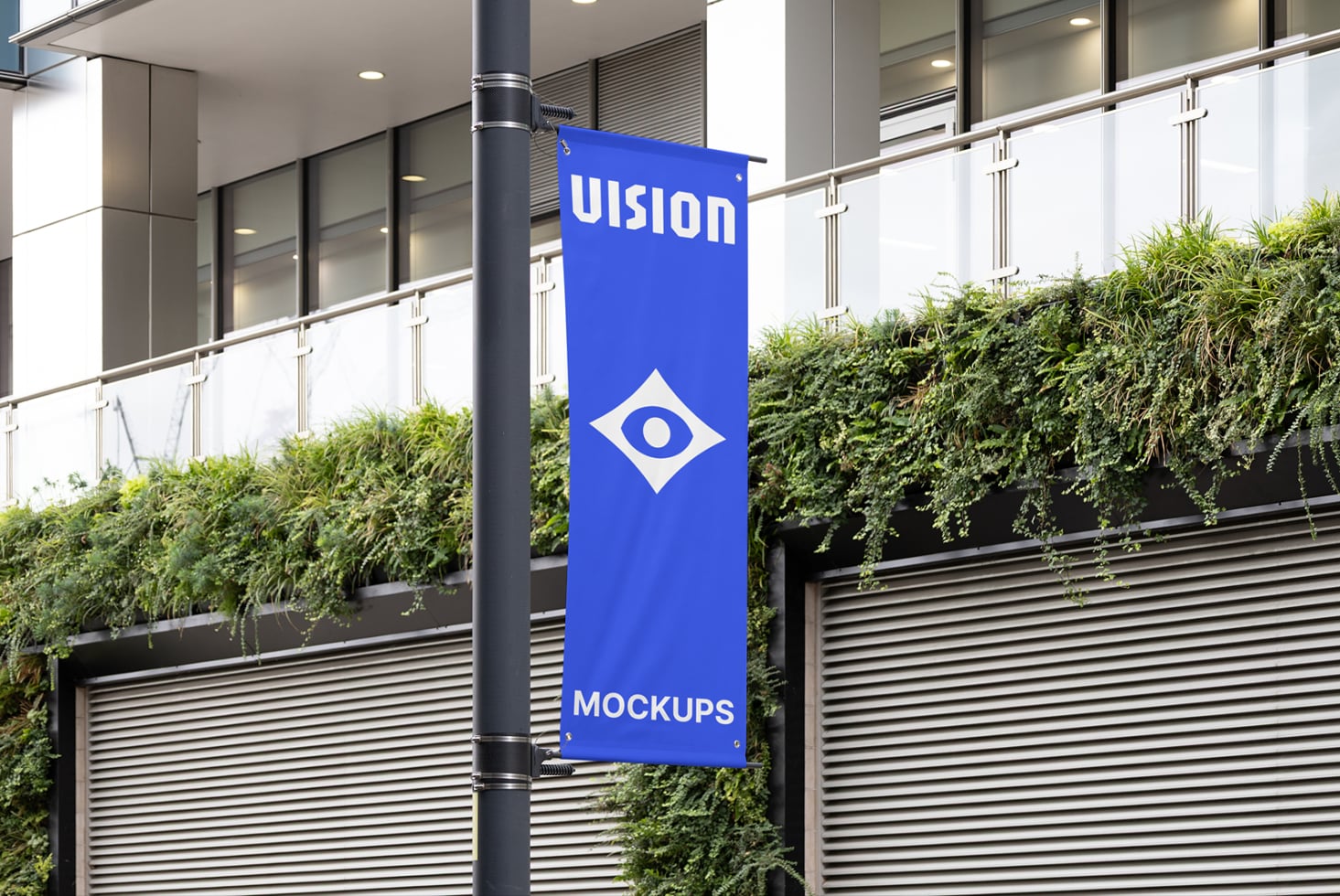 Vertical blue banner hanging on modern building pole with UISION text, eye logo