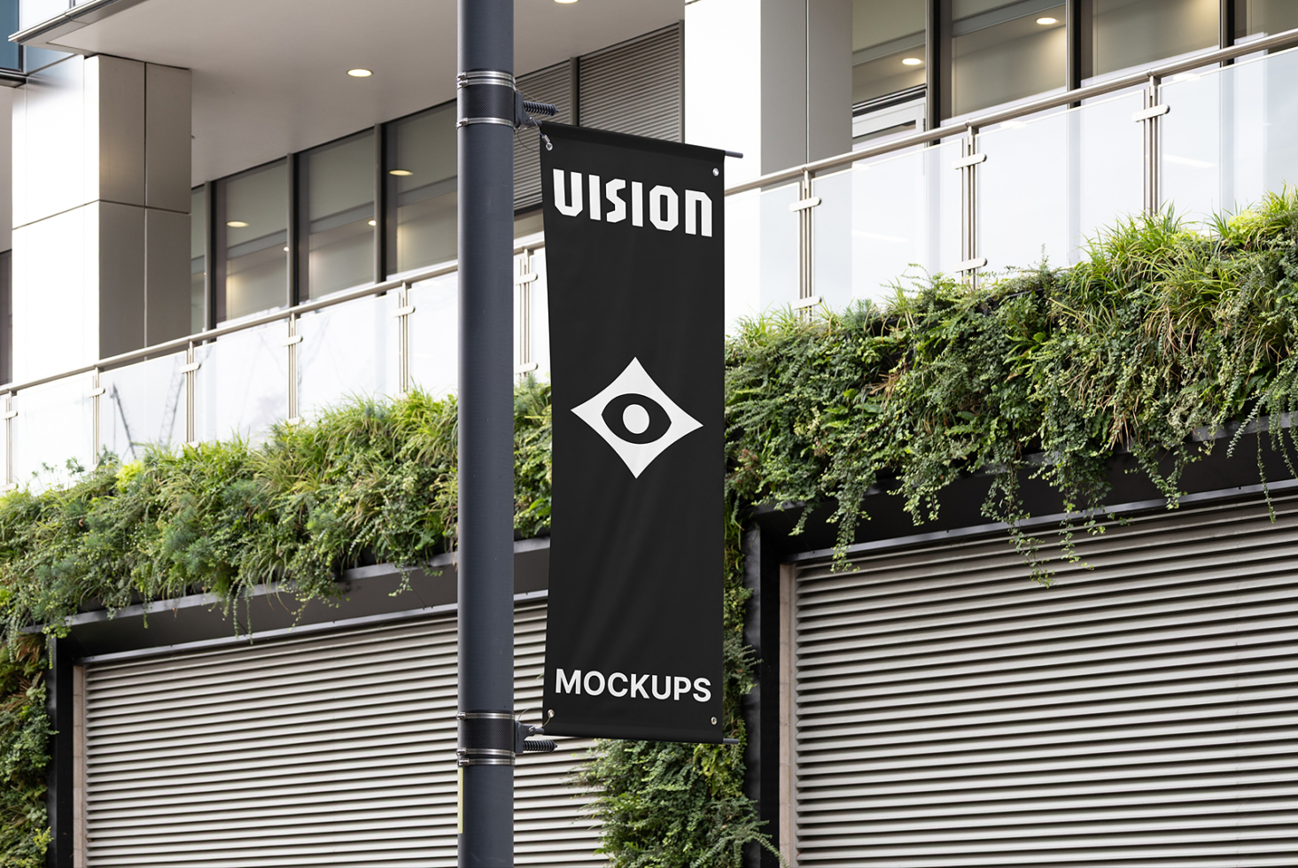 Vertical black banner hanging on modern building pole with UISION text, eye logo