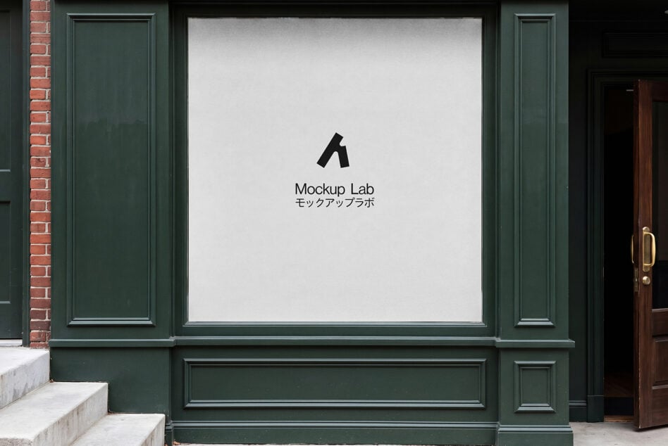 Storefront window with green frame displaying Mockup Lab logo on white wall