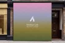 Street-level billboard with soft pink to green gradient displaying Mockup Lab