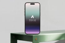 iPhone 14 Pro with notch showing Mockup Lab on gradient teal to purple display