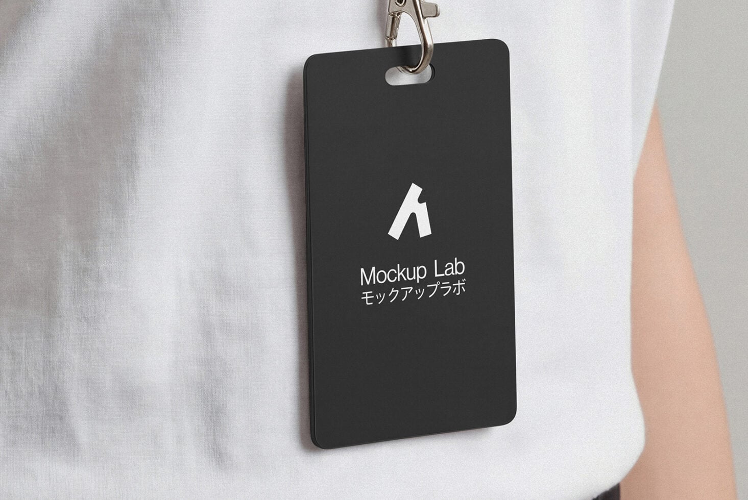 Black vertical ID badge on gray lanyard with white Mockup Lab logo centered