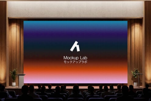 Theater screen with gradient backdrop behind Mockup Lab logo, audience below