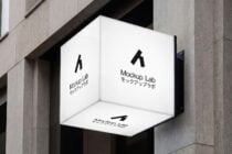 Clean white corner sign mockup mounted on concrete building exterior