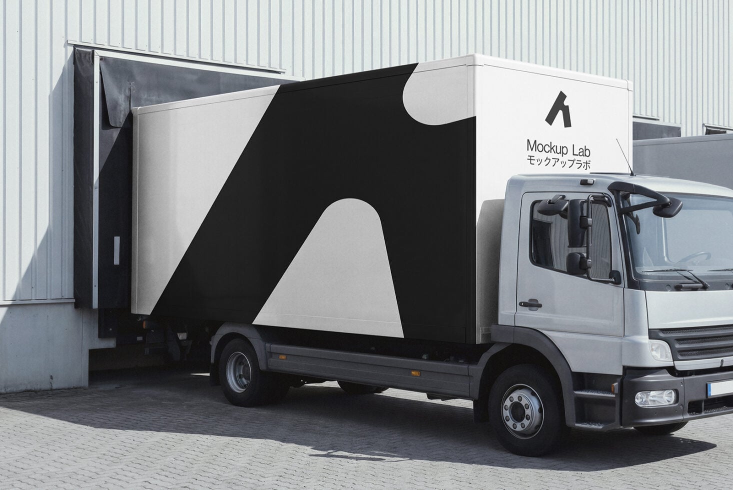 Delivery truck with black curved graphic design plus Mockup Lab logo on white side panel