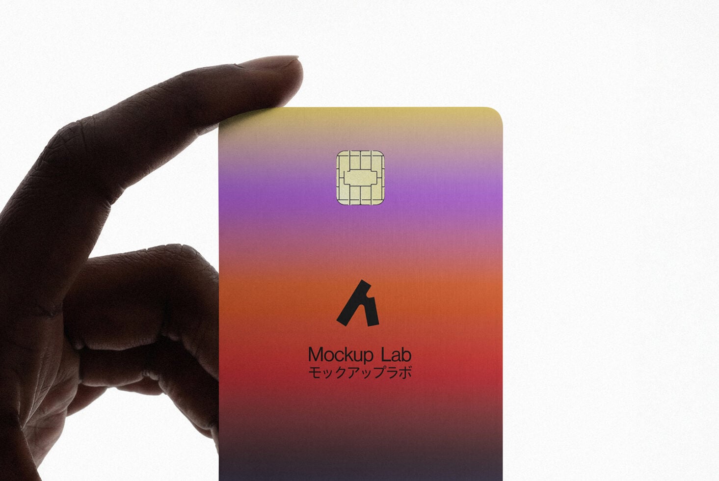 Hand holding credit card with multicolor gradient print