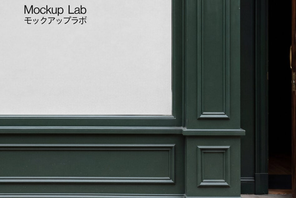 Shop window with white frame displaying Mockup Lab text on glass
