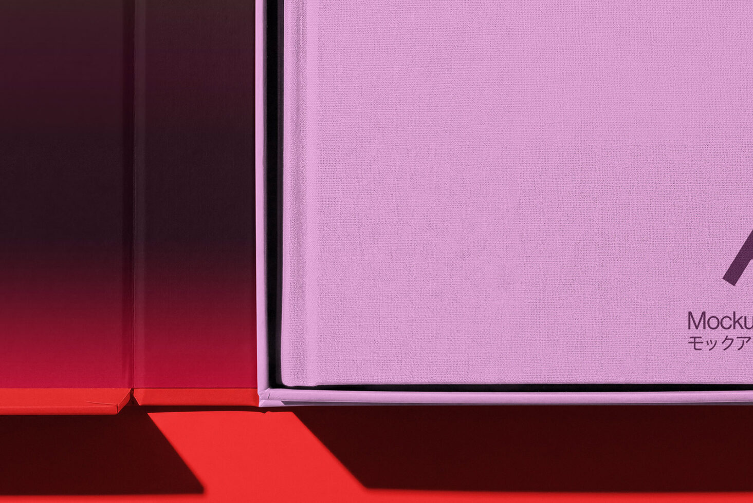 Close-up of pink binder spine next to colorful gradient boxes