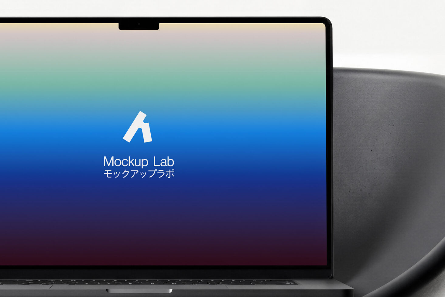 Laptop screen showing blue gradient wallpaper with centered logo