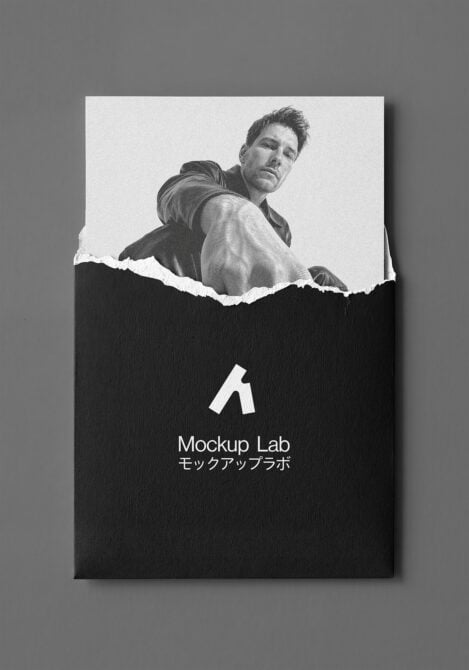 Printed poster on gray background with torn paper design showing portrait