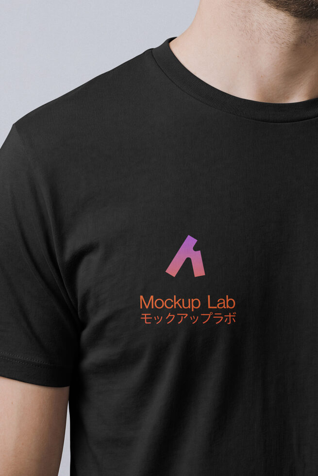 Close-up of black tee showing colorful logo on chest