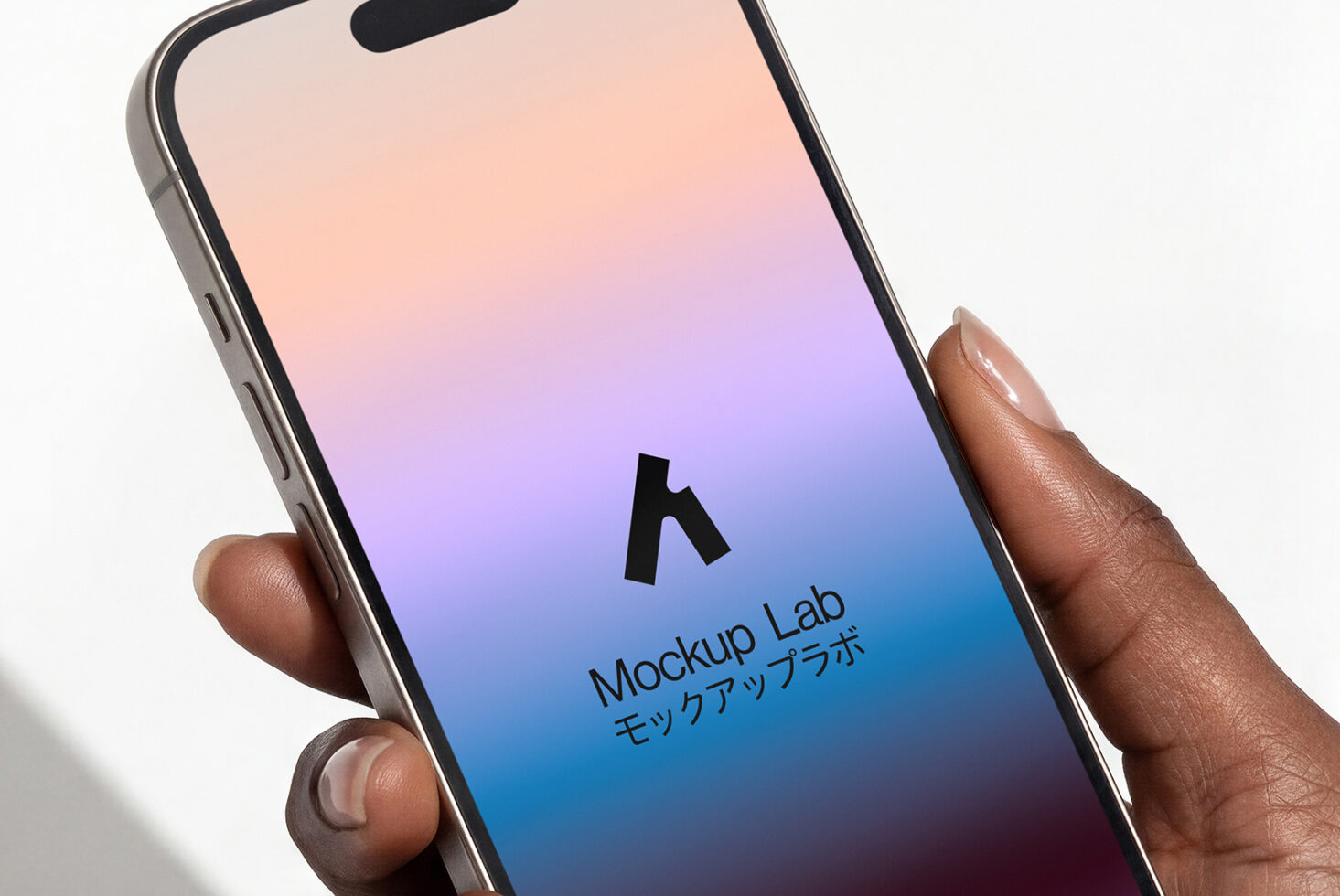 Hand holding phone with gradient peach to blue screen displaying Mockup Lab logo