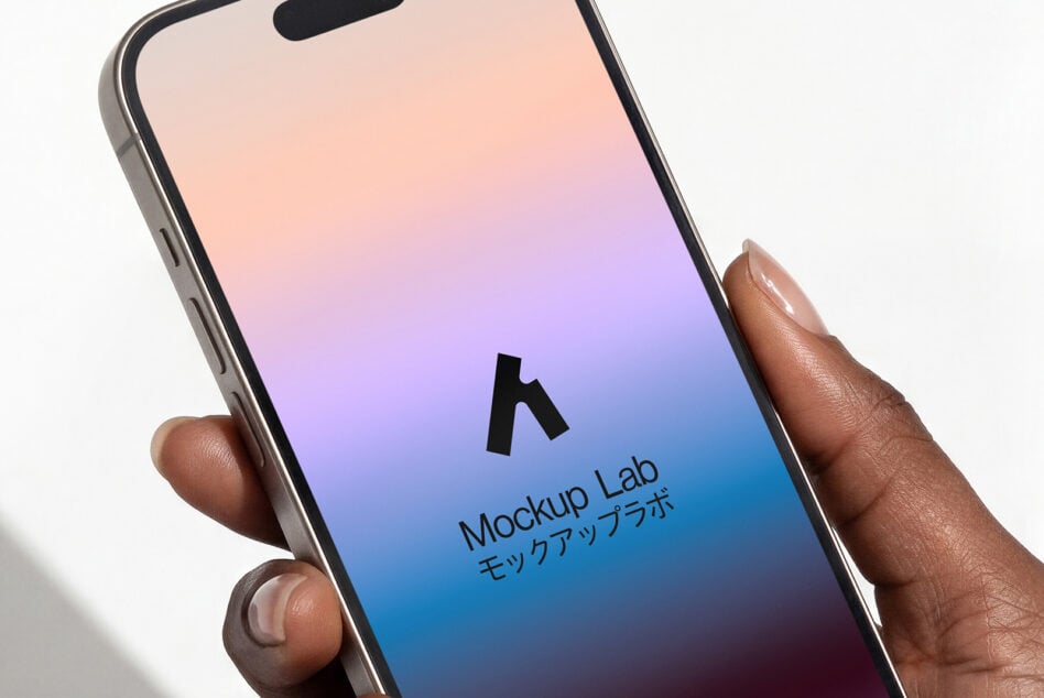 Hand holding phone with gradient peach to blue screen displaying Mockup Lab logo