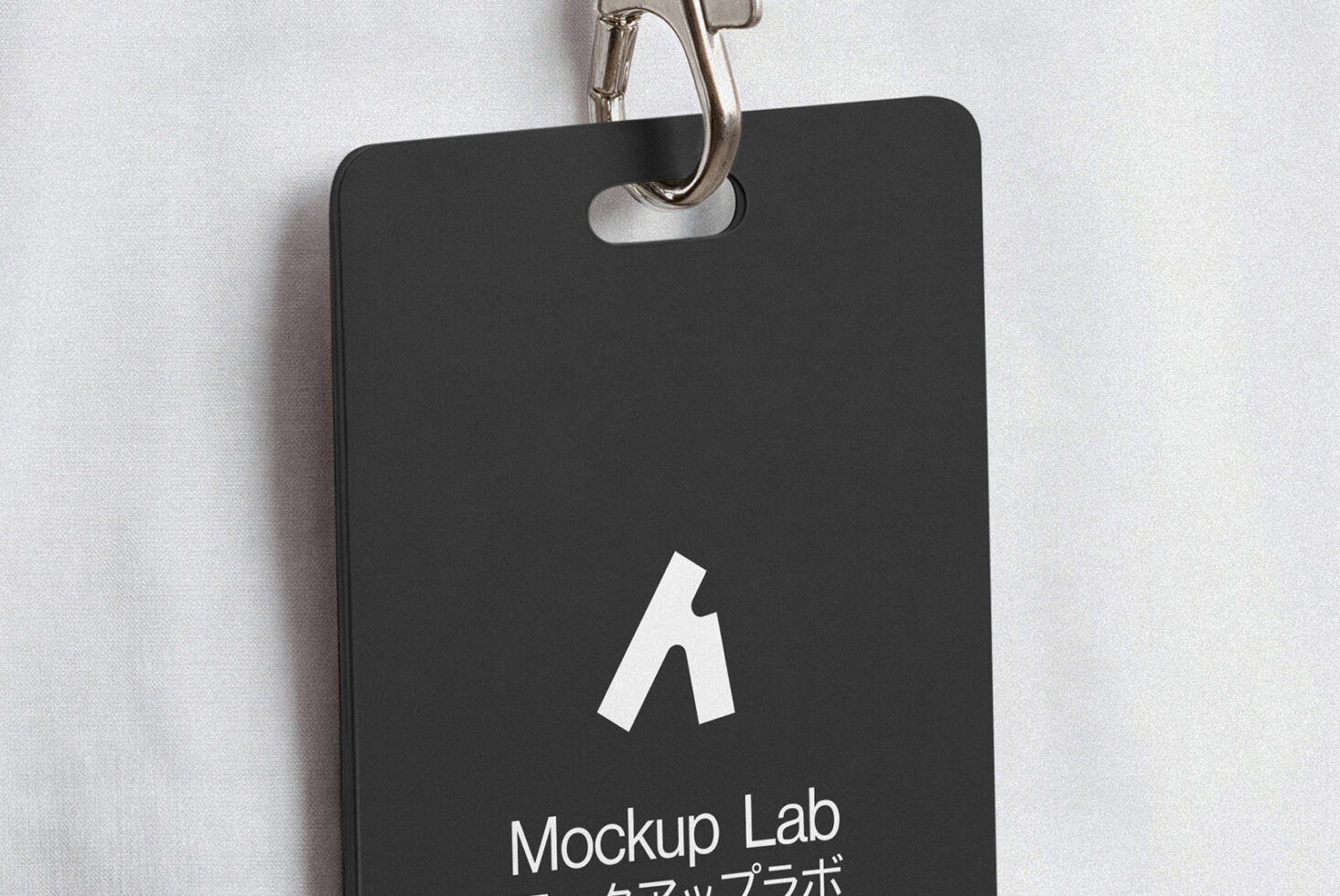 Black keycard hanging on metal ring with white logo emboss
