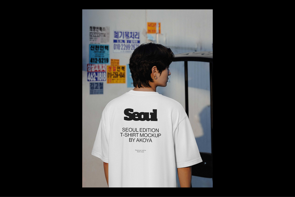 Seoul Edition T-shirt mockup featuring a person in a white tee with urban background. Perfect for graphic designers seeking apparel mockups.