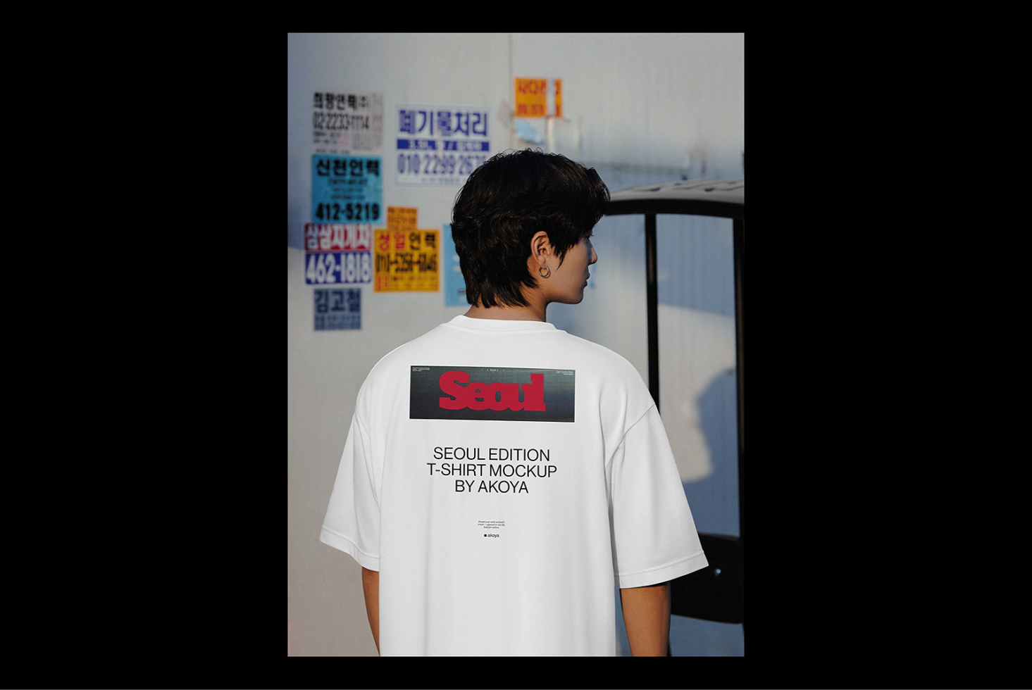 Seoul Edition T-shirt mockup featuring a young person in a white tee with bold red text and urban ambiance. Ideal for fashion designers and graphic projects.