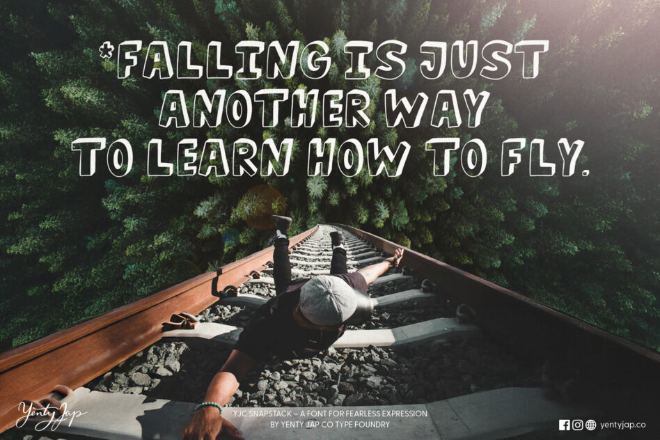 Person on train tracks in forest with motivational text about taking risks