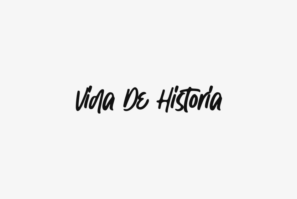 Vida De Historia handwritten script font in black cursive text
