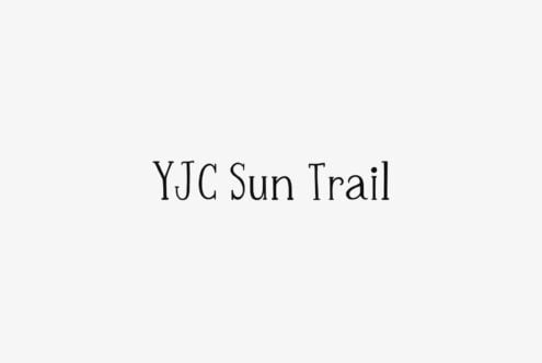 Clean serif font displaying YJC Sun Trail centered on neutral backdrop