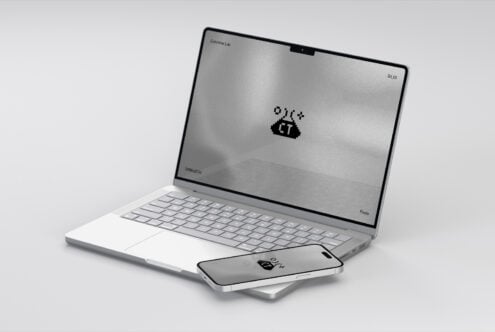 Silver laptop mockup with smartphone on white background