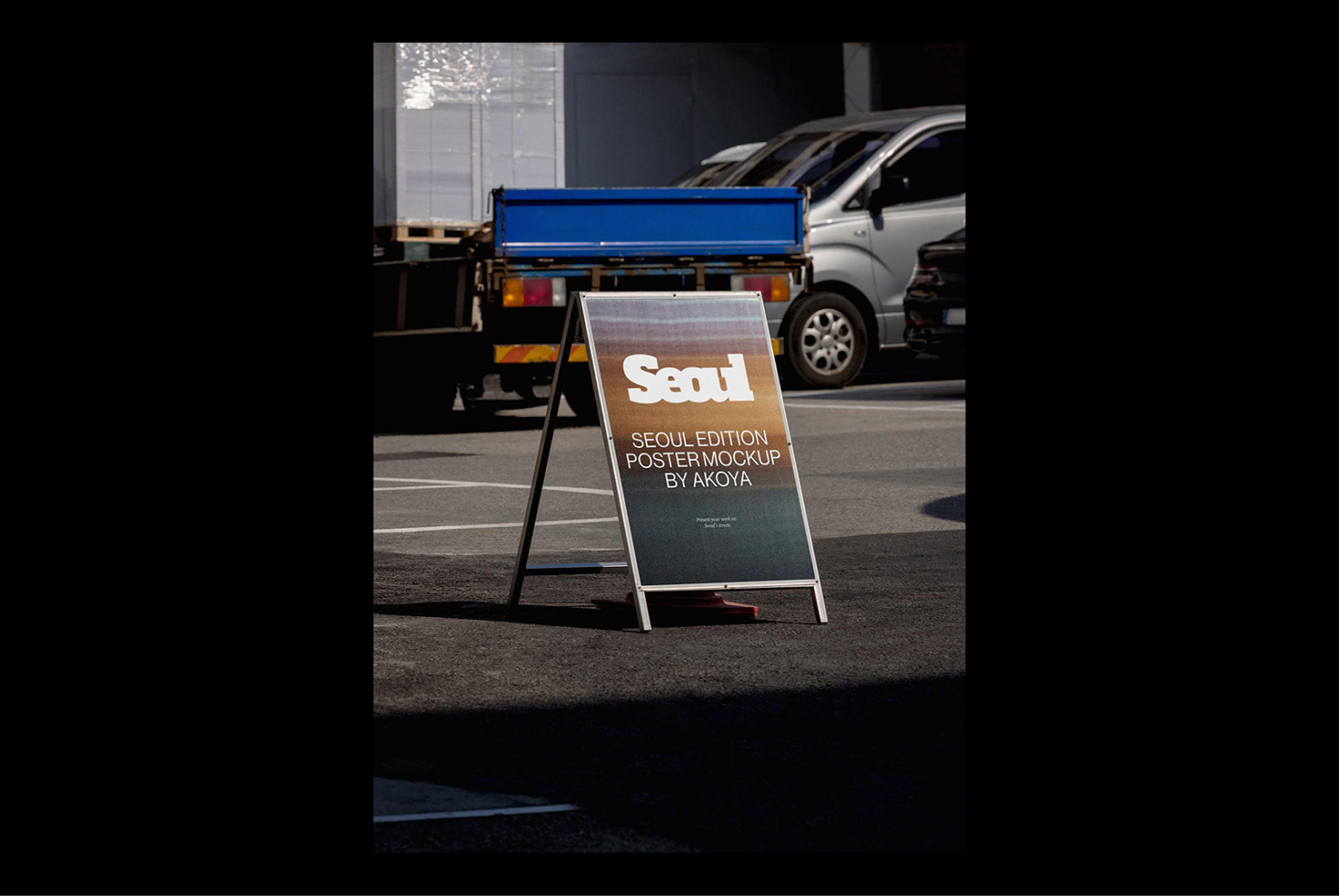 Outdoor A-frame poster mockup featuring Seoul edition design. Ideal for showcasing artwork in urban settings. Perfect for graphic design templates.