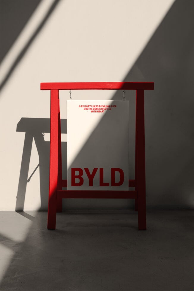 Red wooden stand holding beige card with dark red BYLD text below