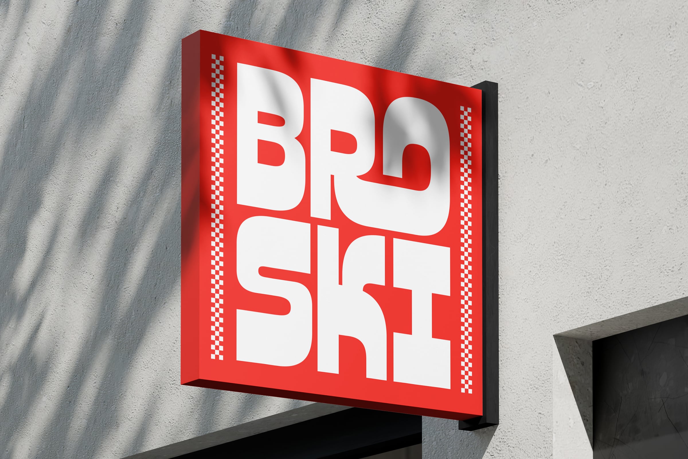 Red 3D sign reading BRO SFT mounted on textured concrete wall surface