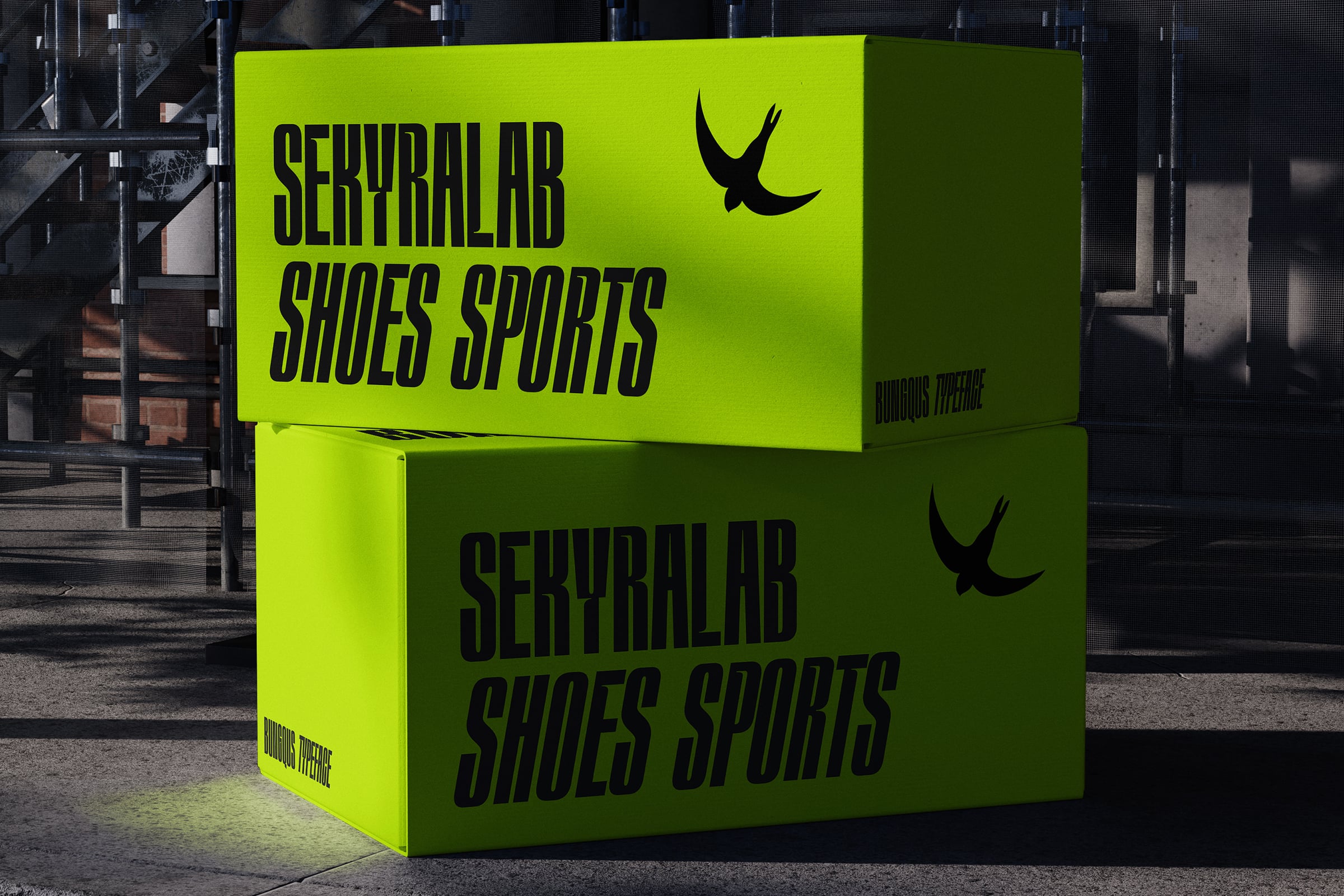 Stacked neon yellow boxes with black text for sports shoe brand mockup in urban setting