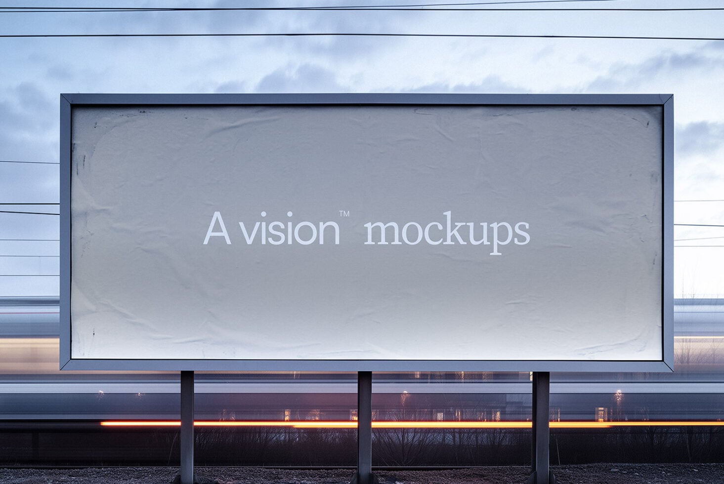 Wide billboard against cloudy sky displaying white serif font on gray surface