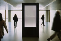 Minimalist digital display in sleek hallway with A vision mockups on neutral background
