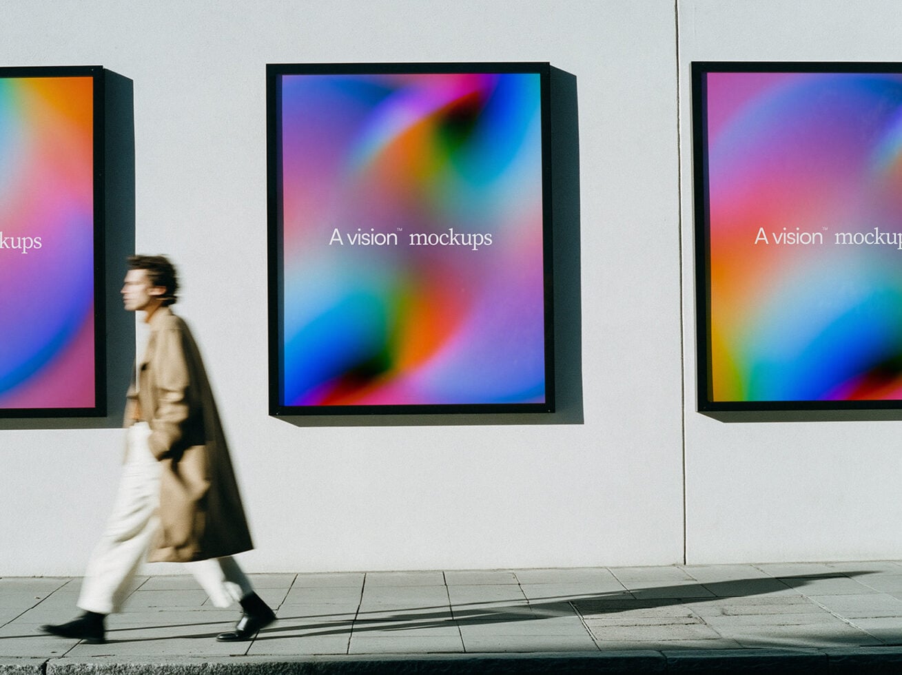 Woman walking past three framed displays showing vibrant gradient meshes on gallery wall
