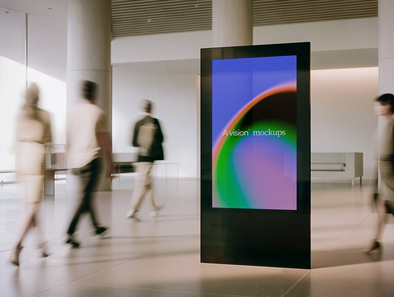 Digital display stand in modern lobby showing colorful gradient with blurred people walking by
