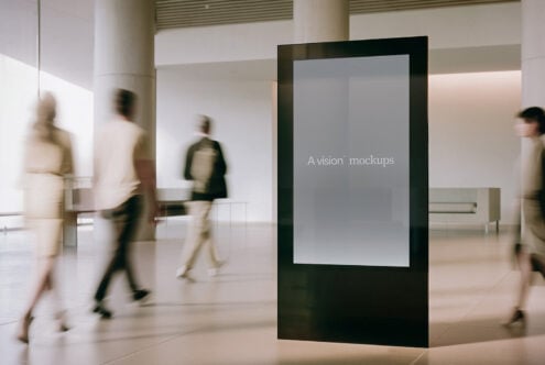 Blank vertical screen display in minimalist gallery with soft natural lighting