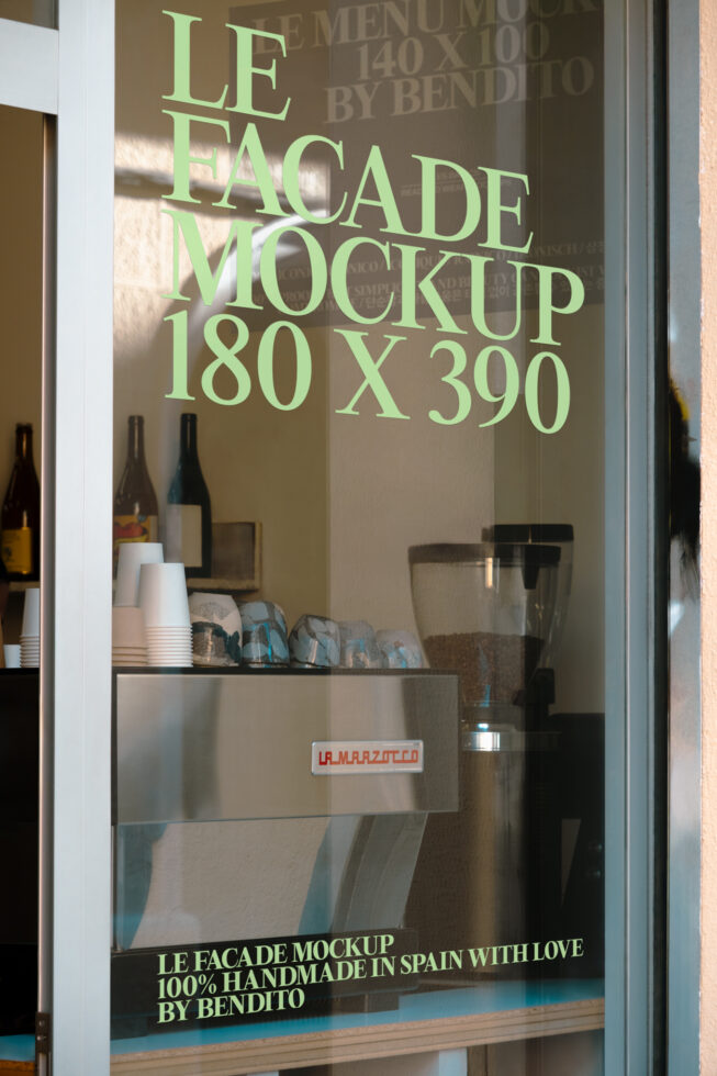 Shop window mockup with green text on glass overlooking cafe bar counter with bottles